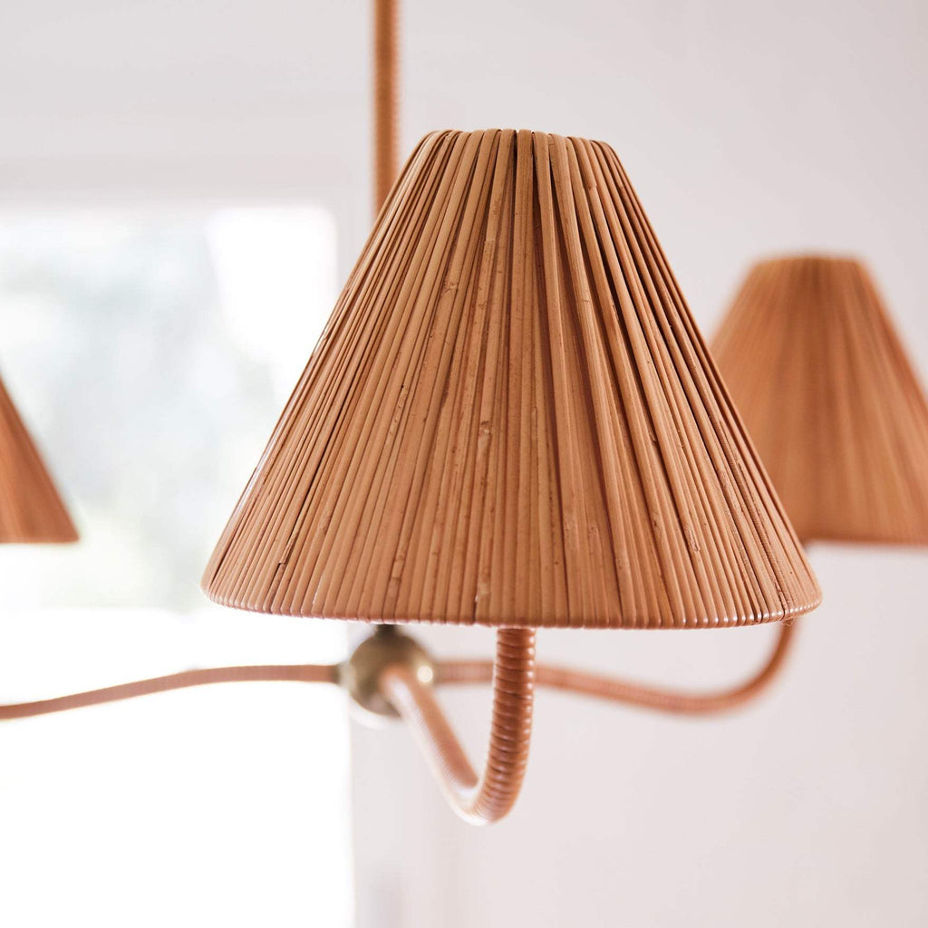 Close-up of a brown pleated lampshade of Delphine chandelier on a white background