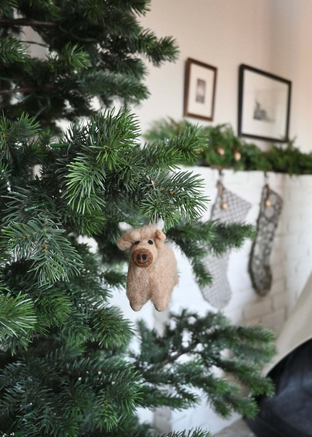 Handcrafted felt Highland cow ornament made from natural wool with rustic Scottish Highlands design