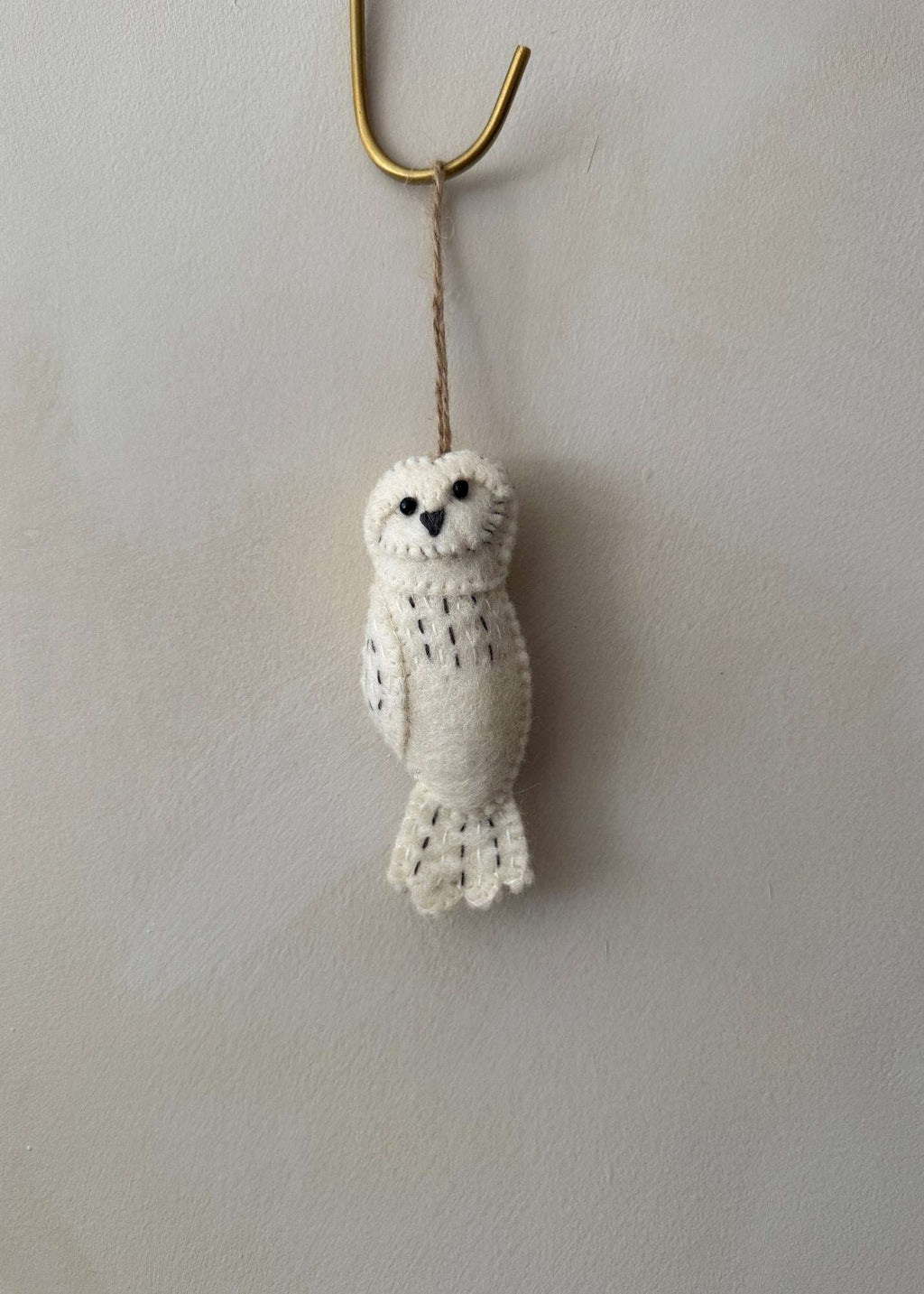Handmade felt owl ornament crafted from wool with detailed needle-felting, perfect for holiday decor or year-round woodland charm