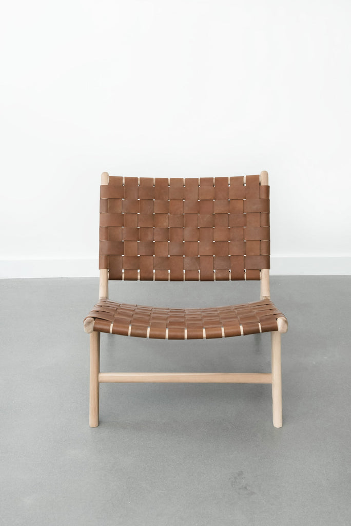 Front view of Woven Leather Strap Lounge Chair - Saddle on white background. Handmade in Bali with Teak wood and vegetable-tanned leather imported from Java. - Saffron and Poe