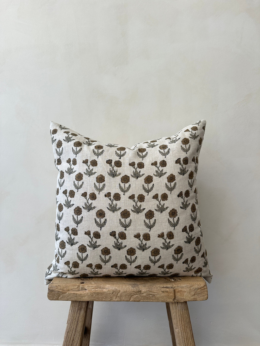 Indian Blockprint Pillow with hand-block-printed linen design and neutral tones on sofa