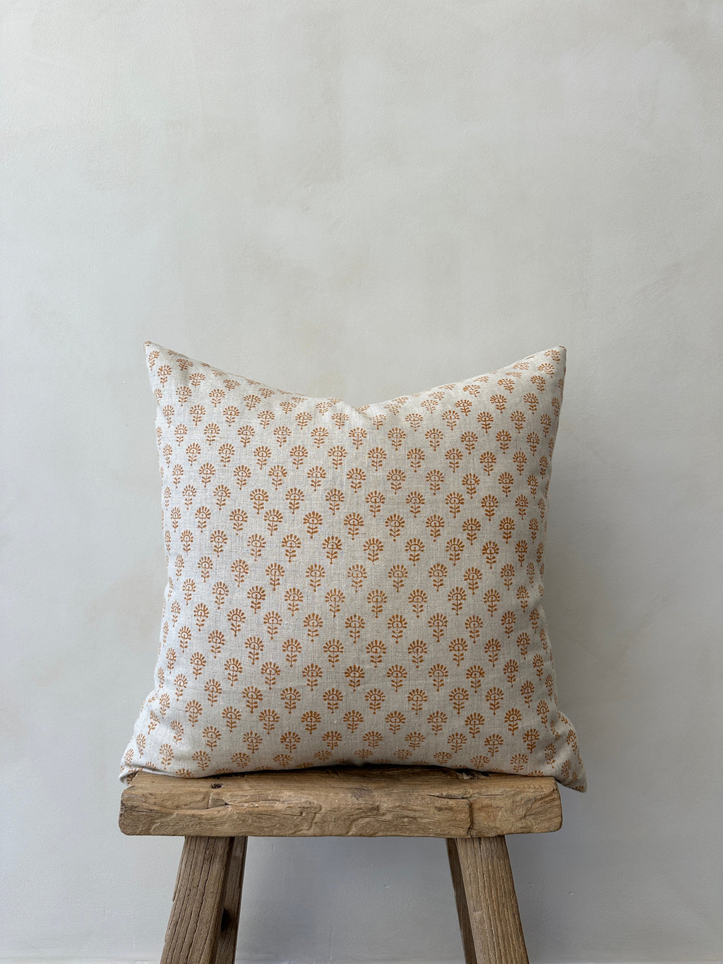 Indian Blockprint Pillow on sofa with intricate hand-block-printed pattern and linen texture