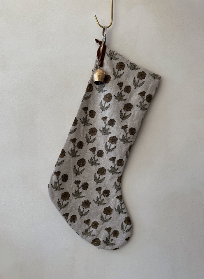 Indian Block Print stocking with floral pattern and bell on a white background - Saffron + Poe