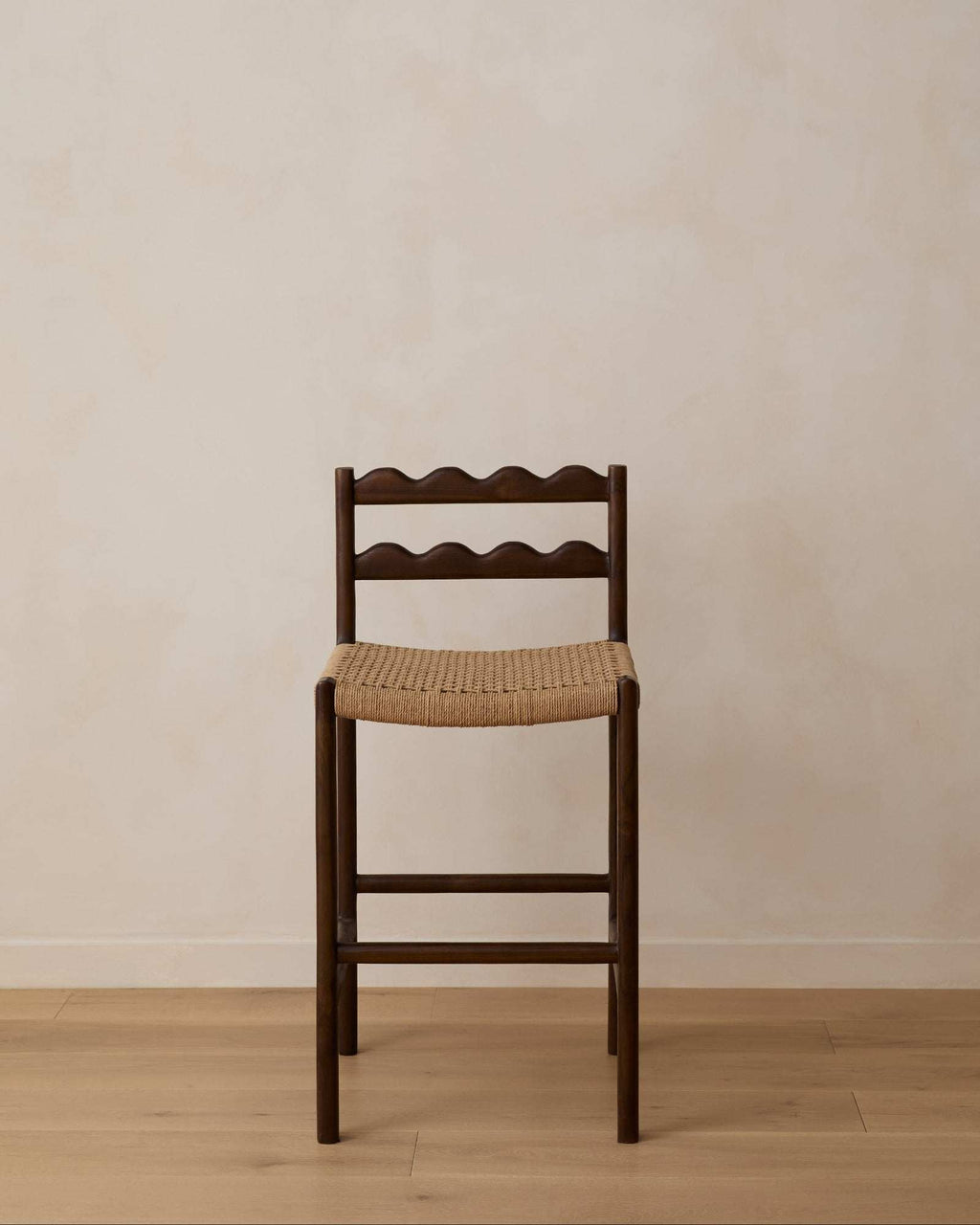 Ionian Scalloped Counter Stool handcrafted from dark walnut teak wood with scalloped backrest and woven paper cord seat