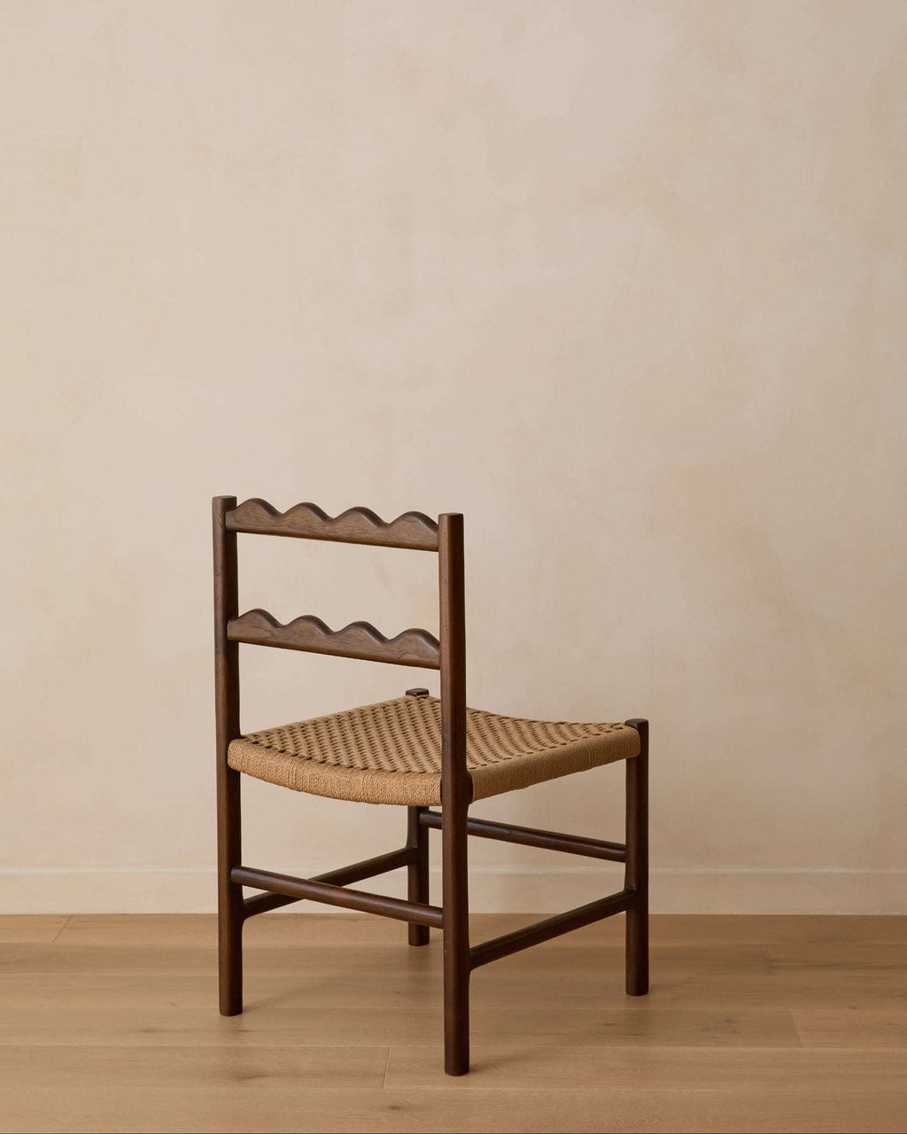 Ionian Scalloped Dining Chair with dark walnut teak frame and handwoven paper cord seat