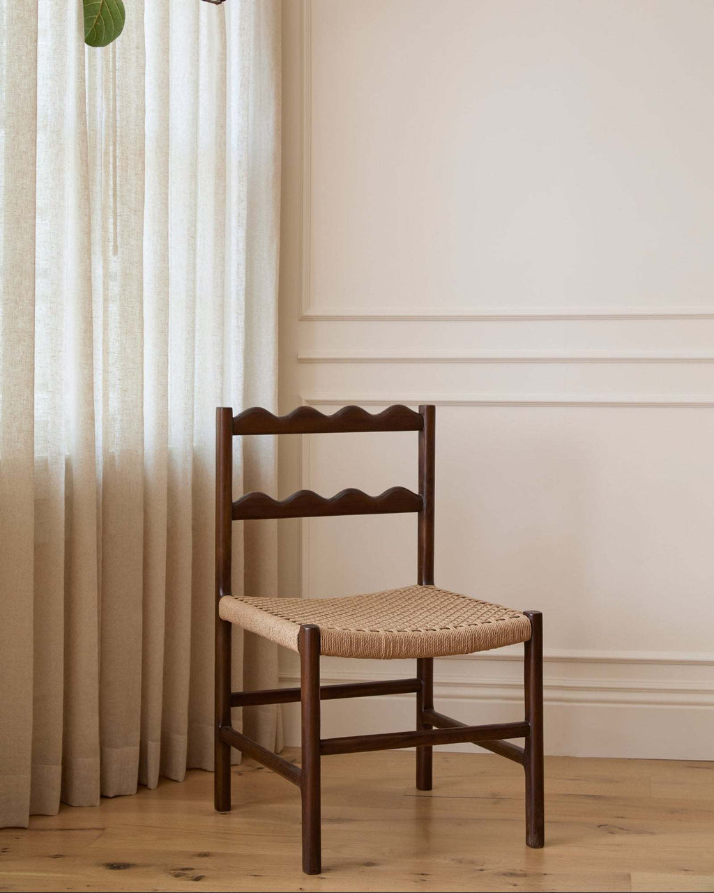 Ionian Scalloped Dining Chair in dark walnut teak with handwoven paper cord seat and scalloped backrest