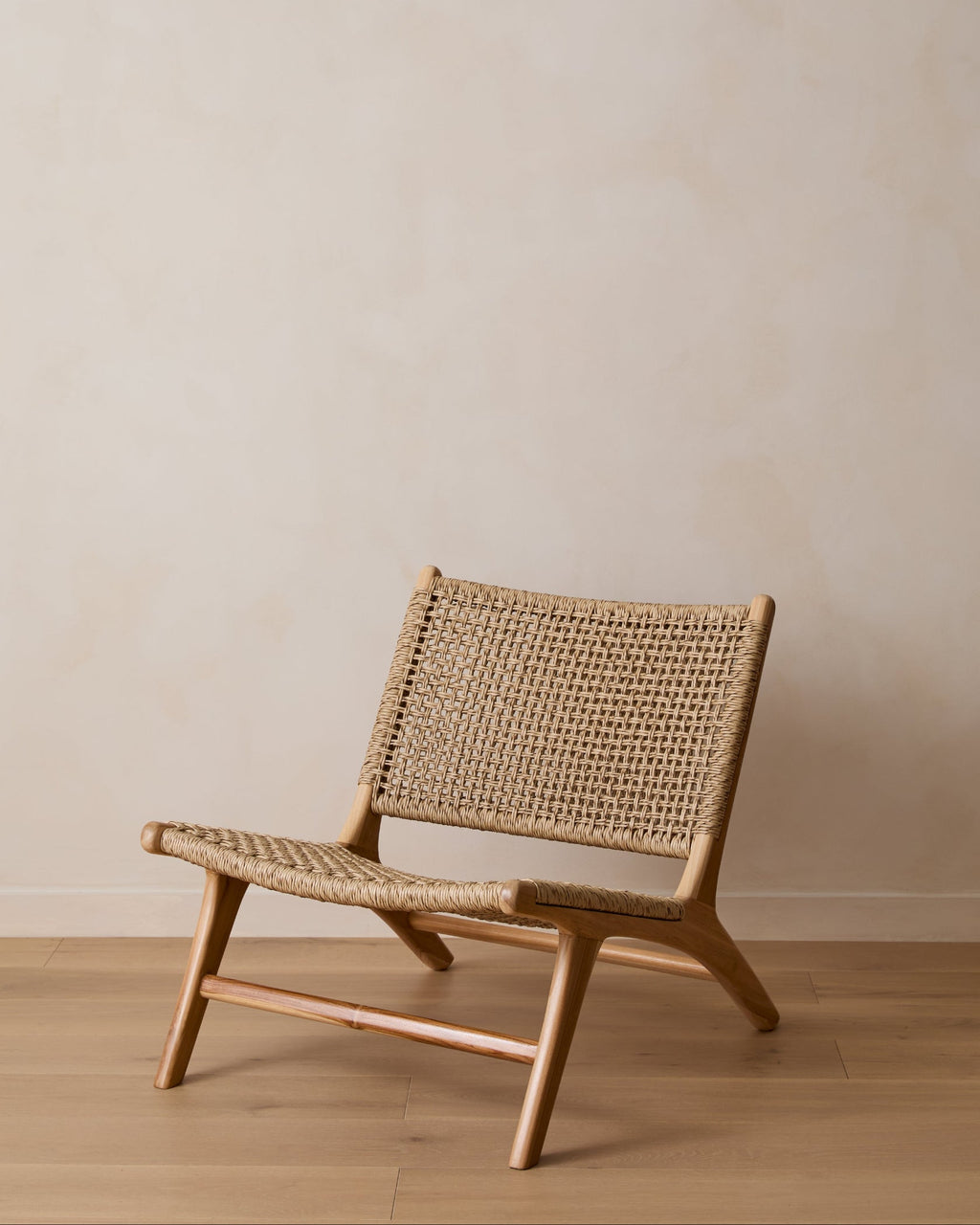 Weatherproof Marin Lounge Chair with teak frame and faux rattan weave, second quality with minor imperfections