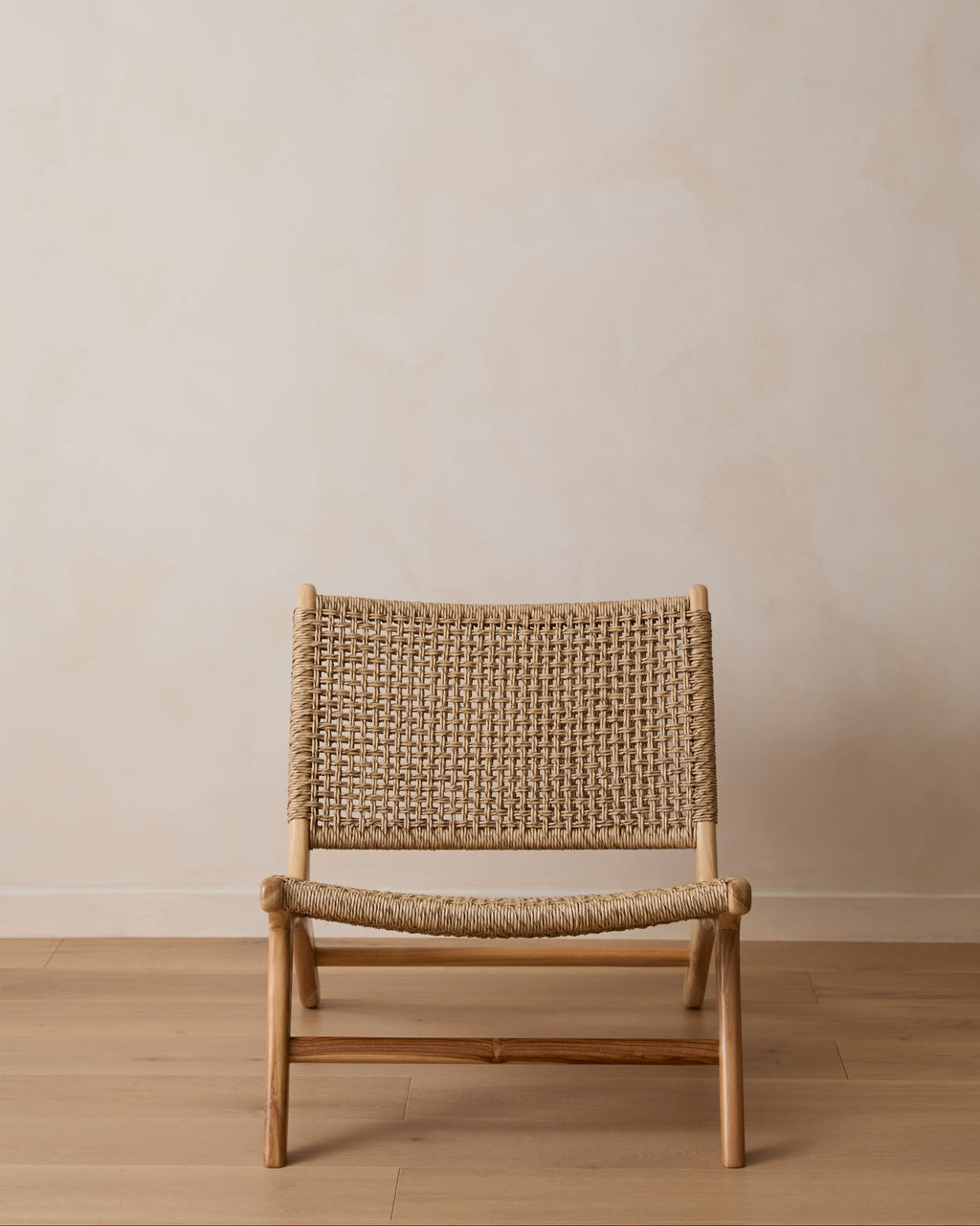 Marin Lounge Chair with teak frame and weatherproof faux rattan weave for indoor and outdoor use