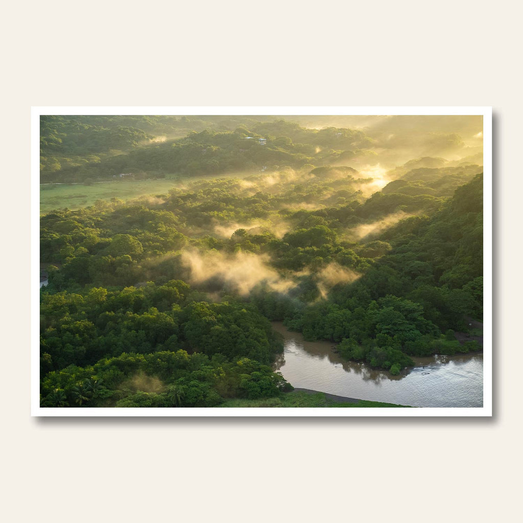 Morning mist over lush Costa Rica rainforest landscape at sunrise