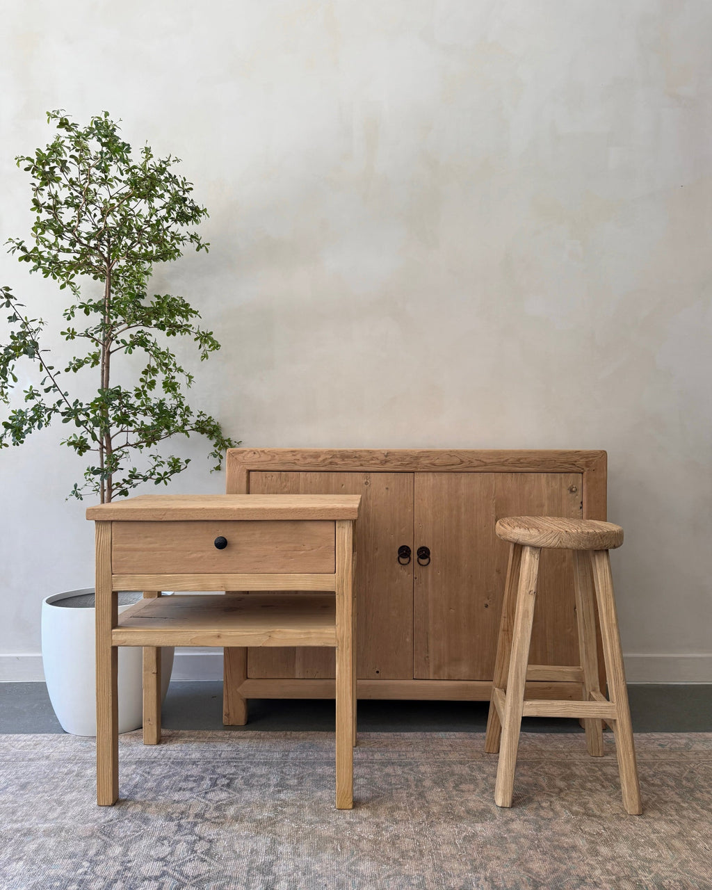 Vintage elmwood counter stool handcrafted from reclaimed wood with a sculpted seat and rustic design