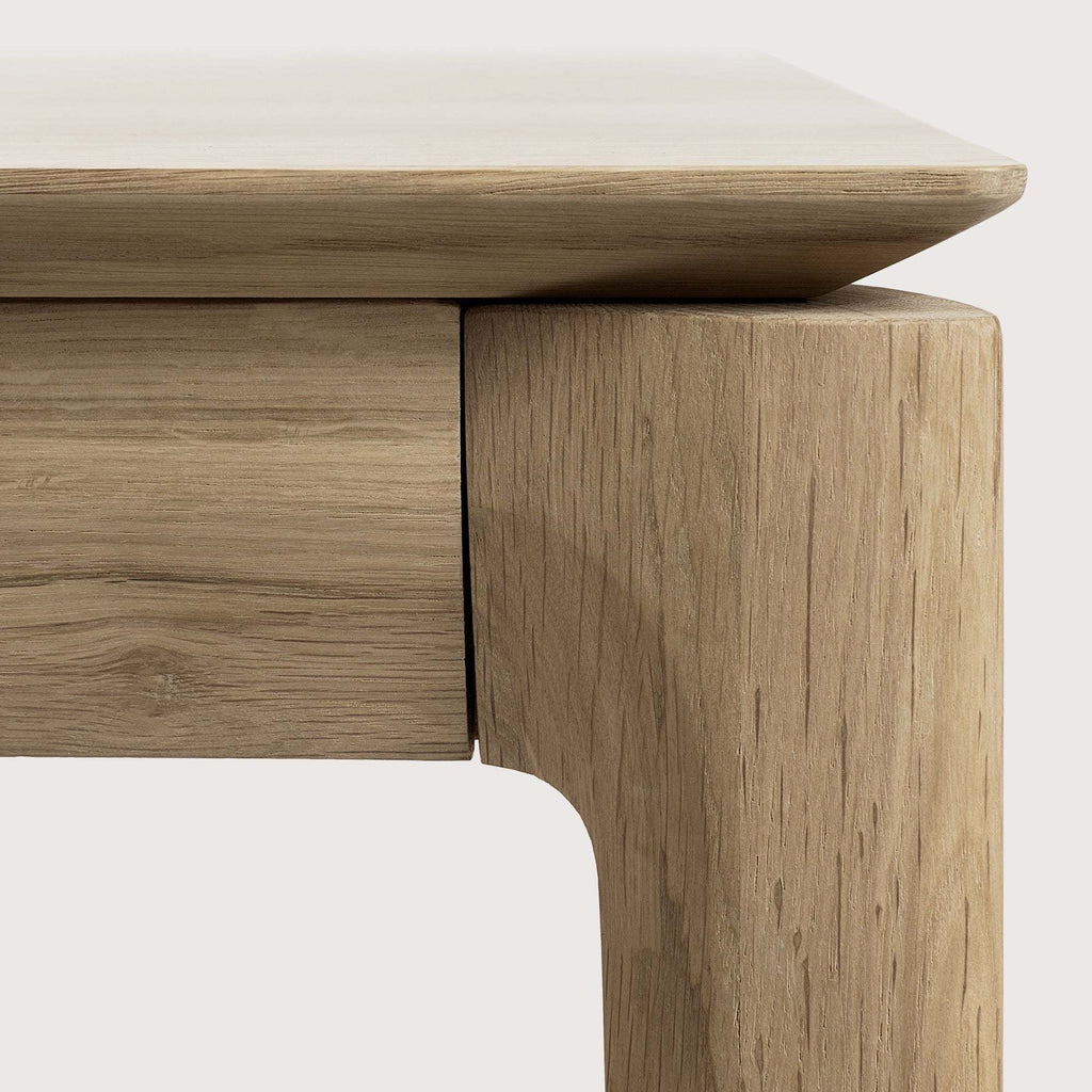 Bok Dining Table in white oak with contoured frame and floating top design