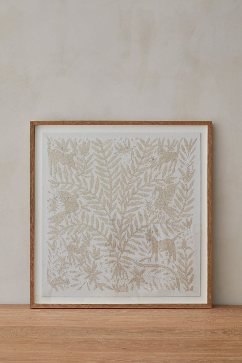 Hand-embroidered Otomi textile with vibrant traditional patterns and intricate stitches