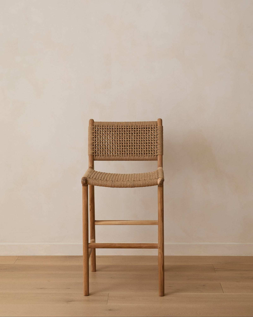 Handwoven paper cord counter stool with natural teak frame and curved backrest