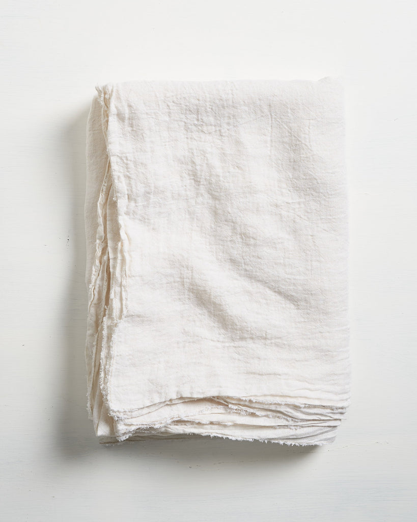 White Philo Linen tablecloth on a light gray background