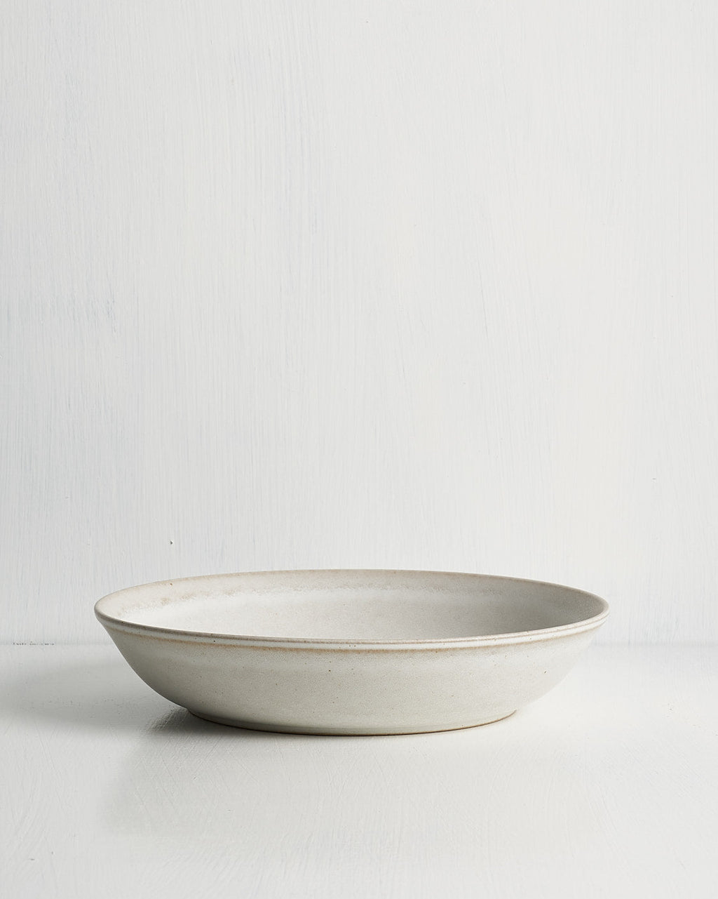 White ceramic Pillar Entry bowl on a light gray background