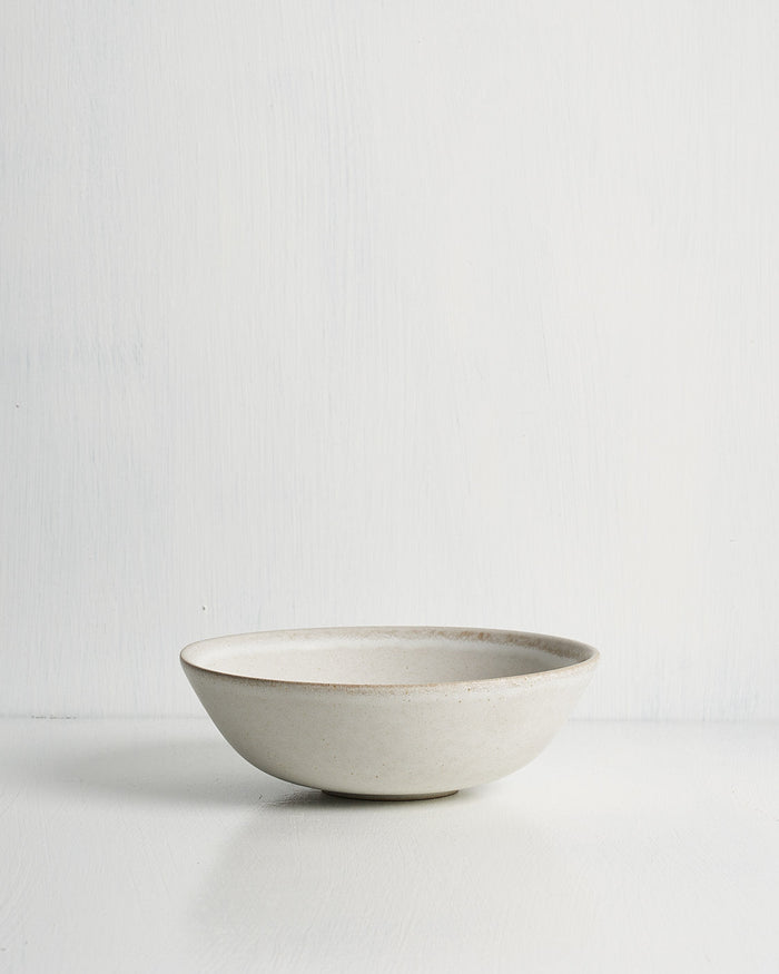 White ceramic Pillar low small bowl on a light gray background