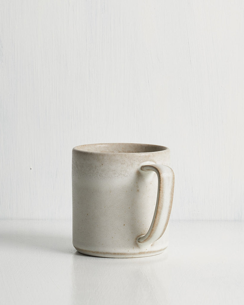 White ceramic Pillar mug on a light gray background