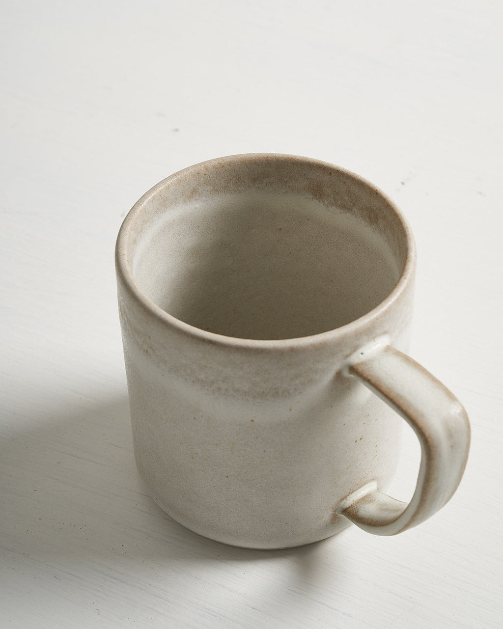 White ceramic Pillar mug on a light gray background