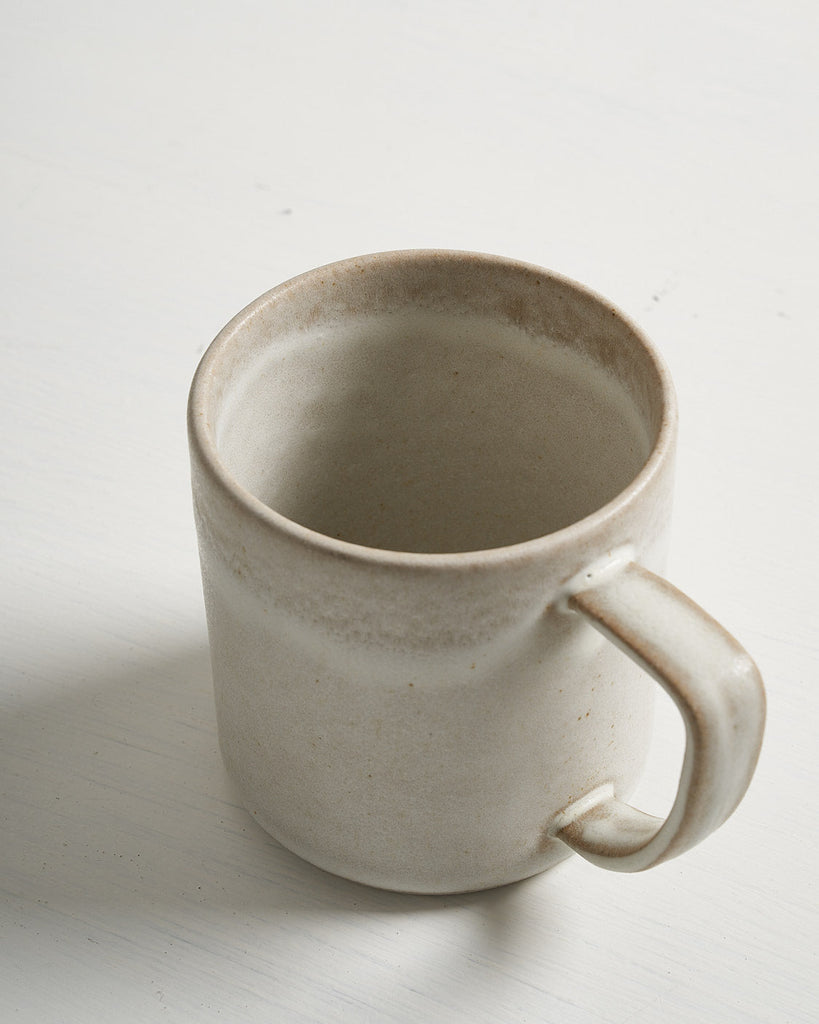 White ceramic Pillar mug on a light gray background