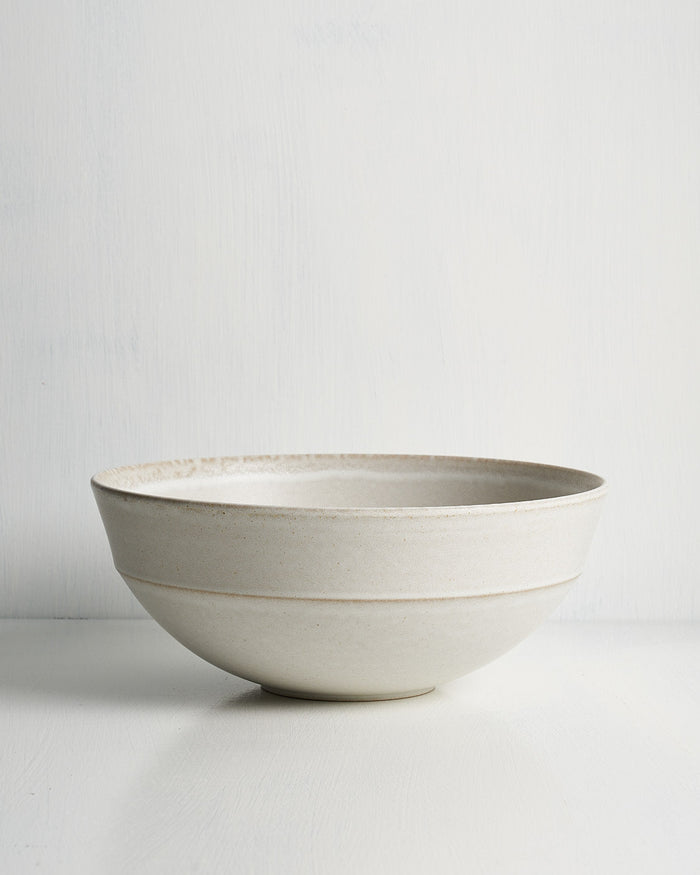 White ceramic Pillar Deep Serving bowl on a light gray background