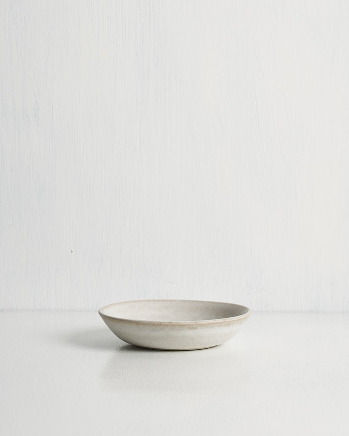White ceramic Pillar Snack bowl on a light gray background