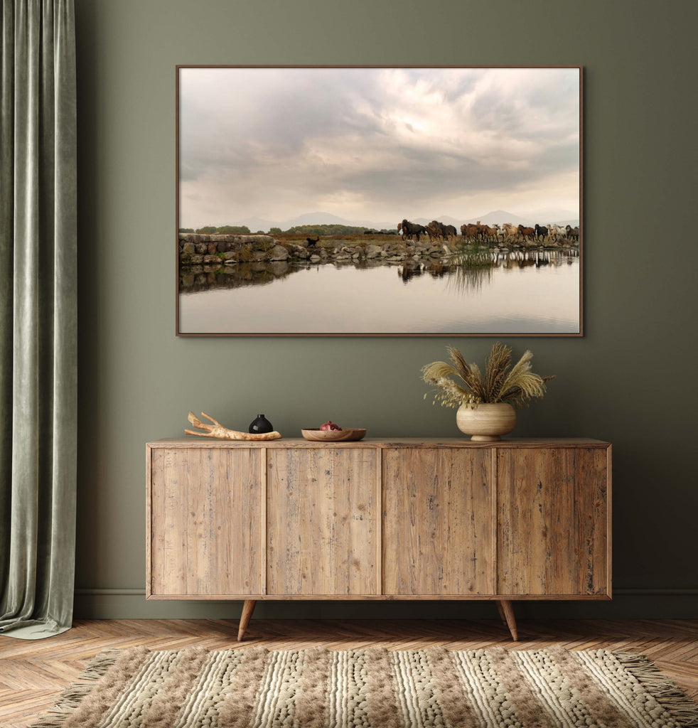 Landscape photo of a herd of horses reflected in water in a room by Mika Street for Saffron and Poe