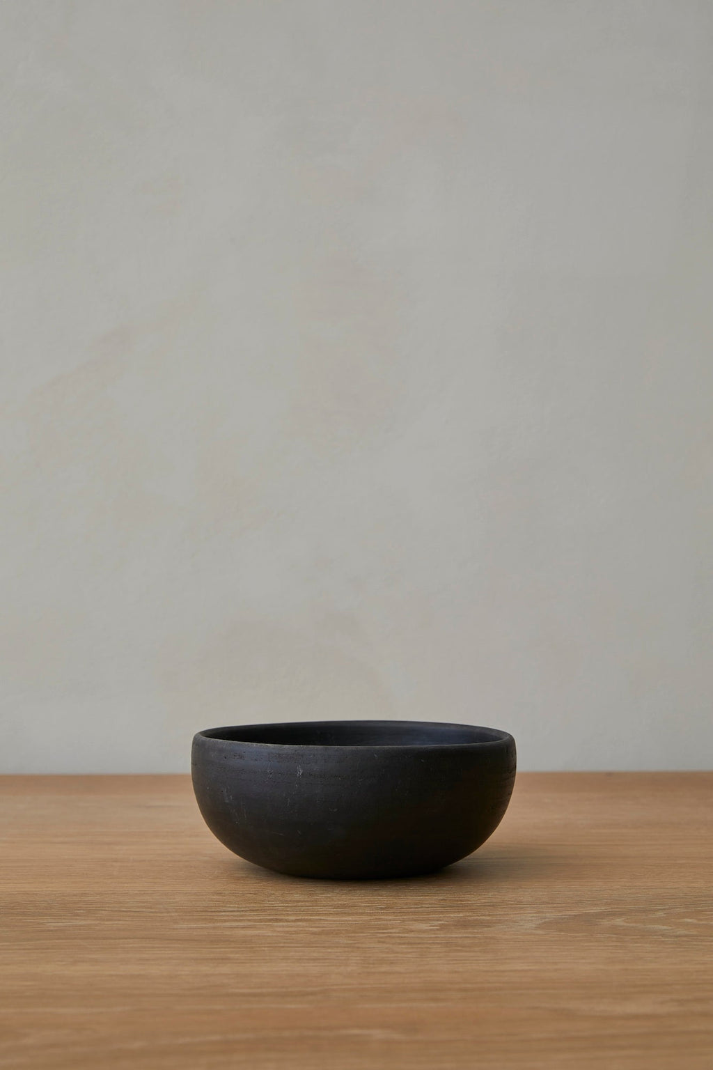 Oaxacan Handmade Ceramic Bowl in black with rustic ceramic texture and organic curved shape