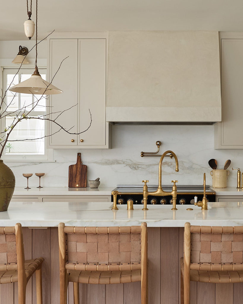 Modern kitchen with an island and counter stools and kitchen accessories