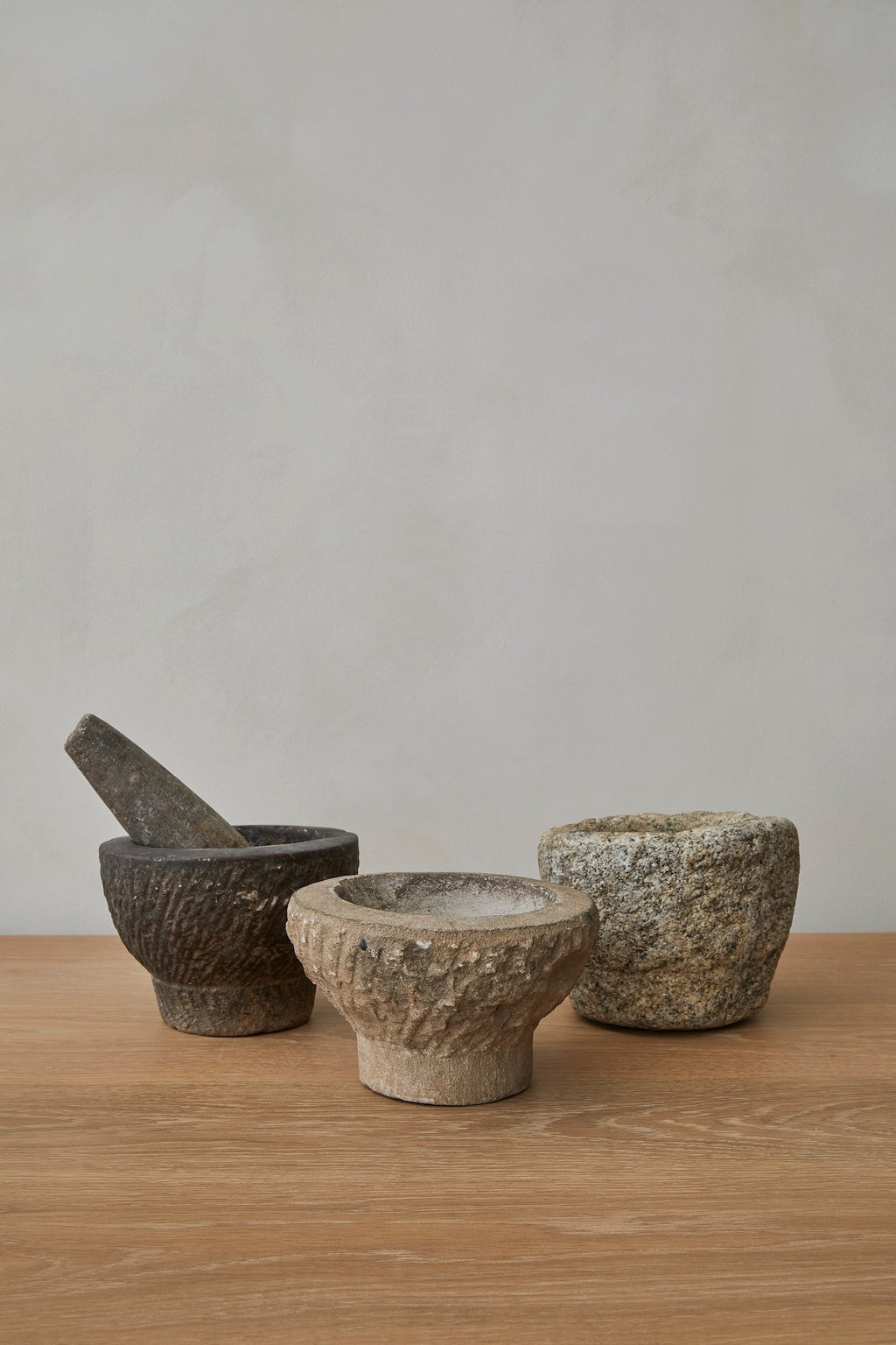 Antique Chinese stone mortar and pestle with textured patina for decorative use
