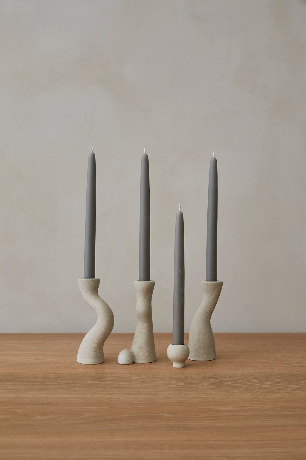 Set of hand-cast terrazzo candle stick holders with modern design and polished finish
