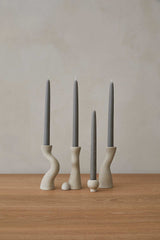 Set of hand-cast terrazzo candle stick holders with modern design and polished finish