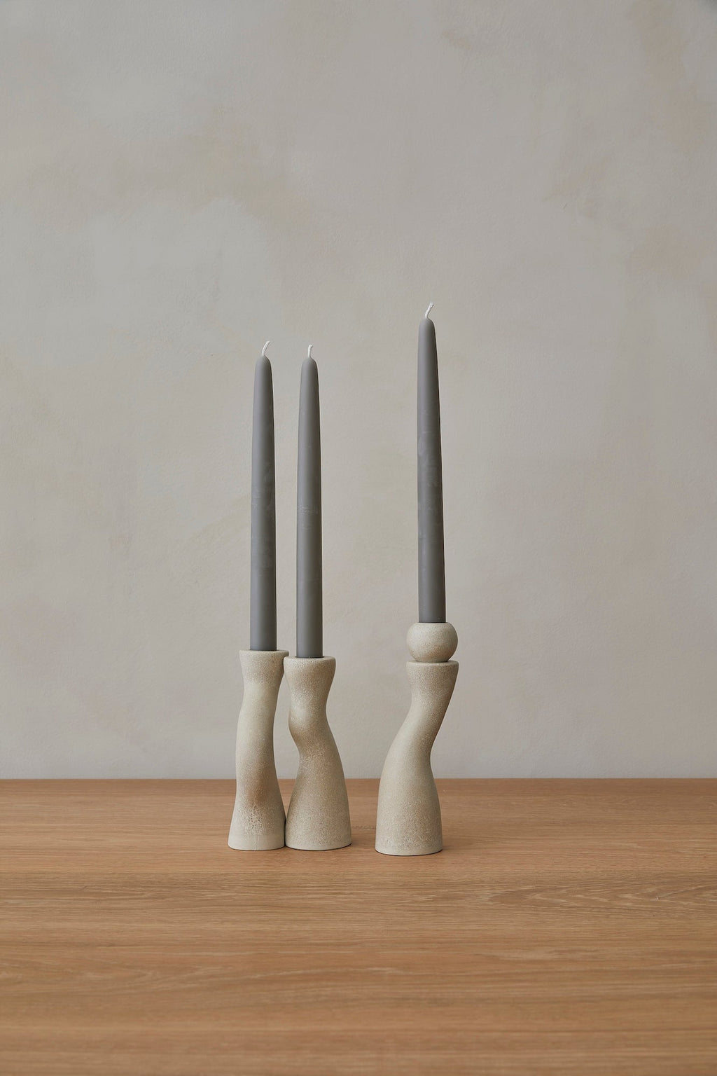 Modern terrazzo candle stick holder set with polished, hand-cast design and nesting functionality