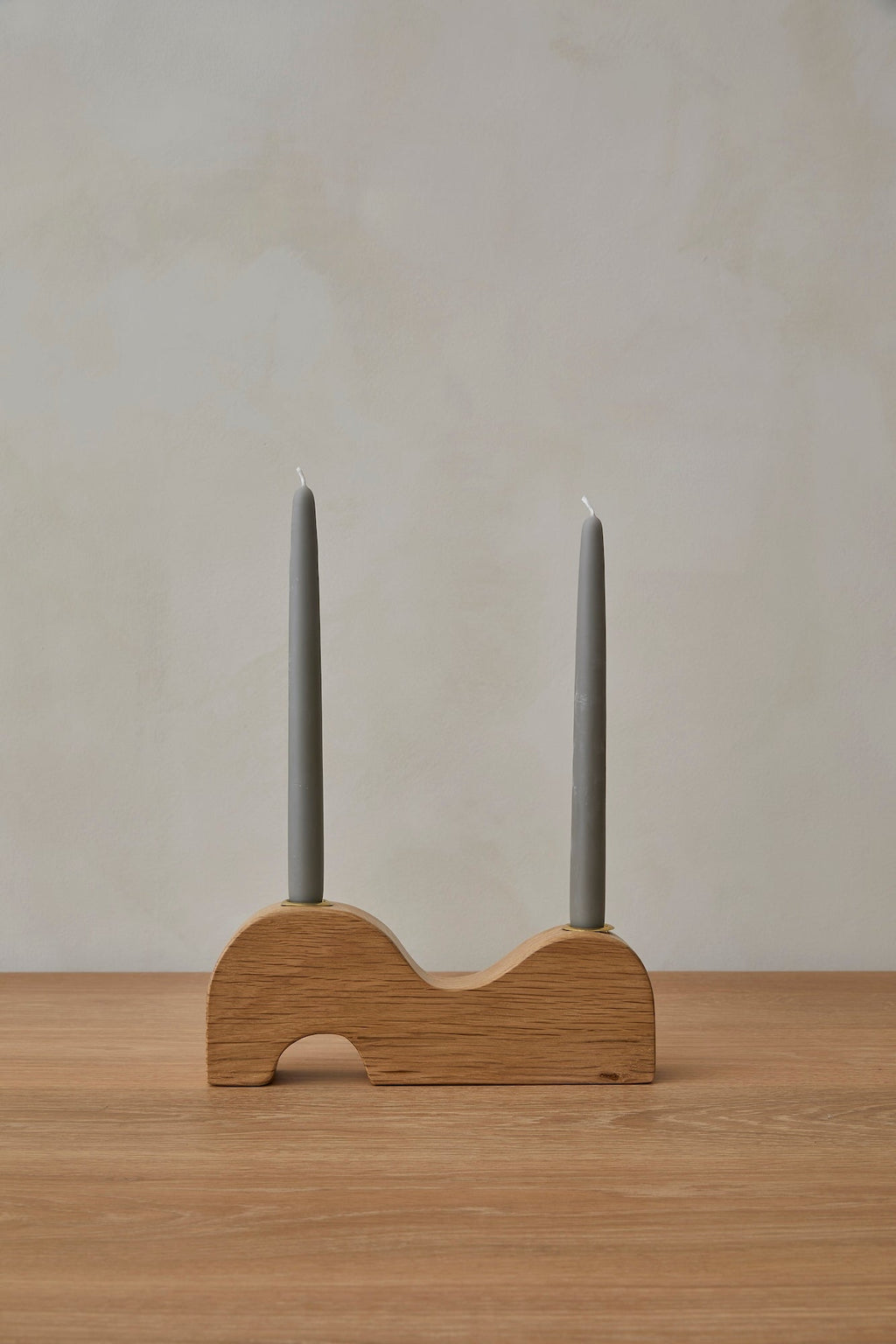 Wave Candlestick Holder made of white oak with brass accents and organic design