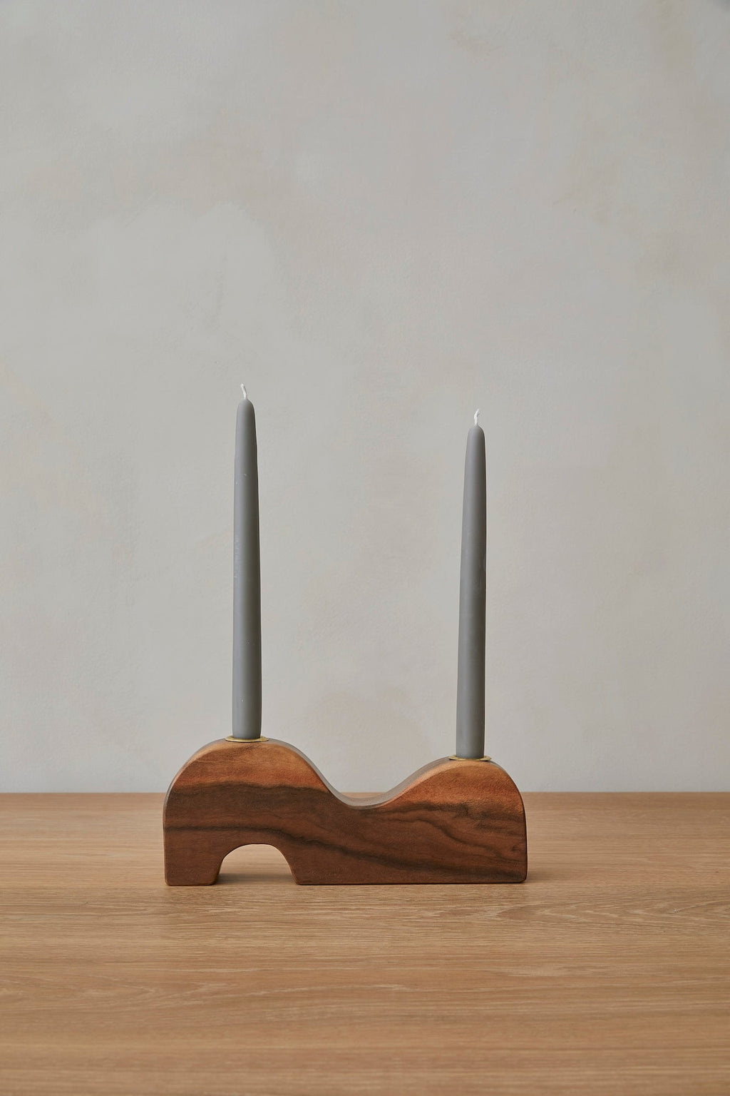 Wave Candlestick Holder made from black walnut wood with brass accents and sculptural design