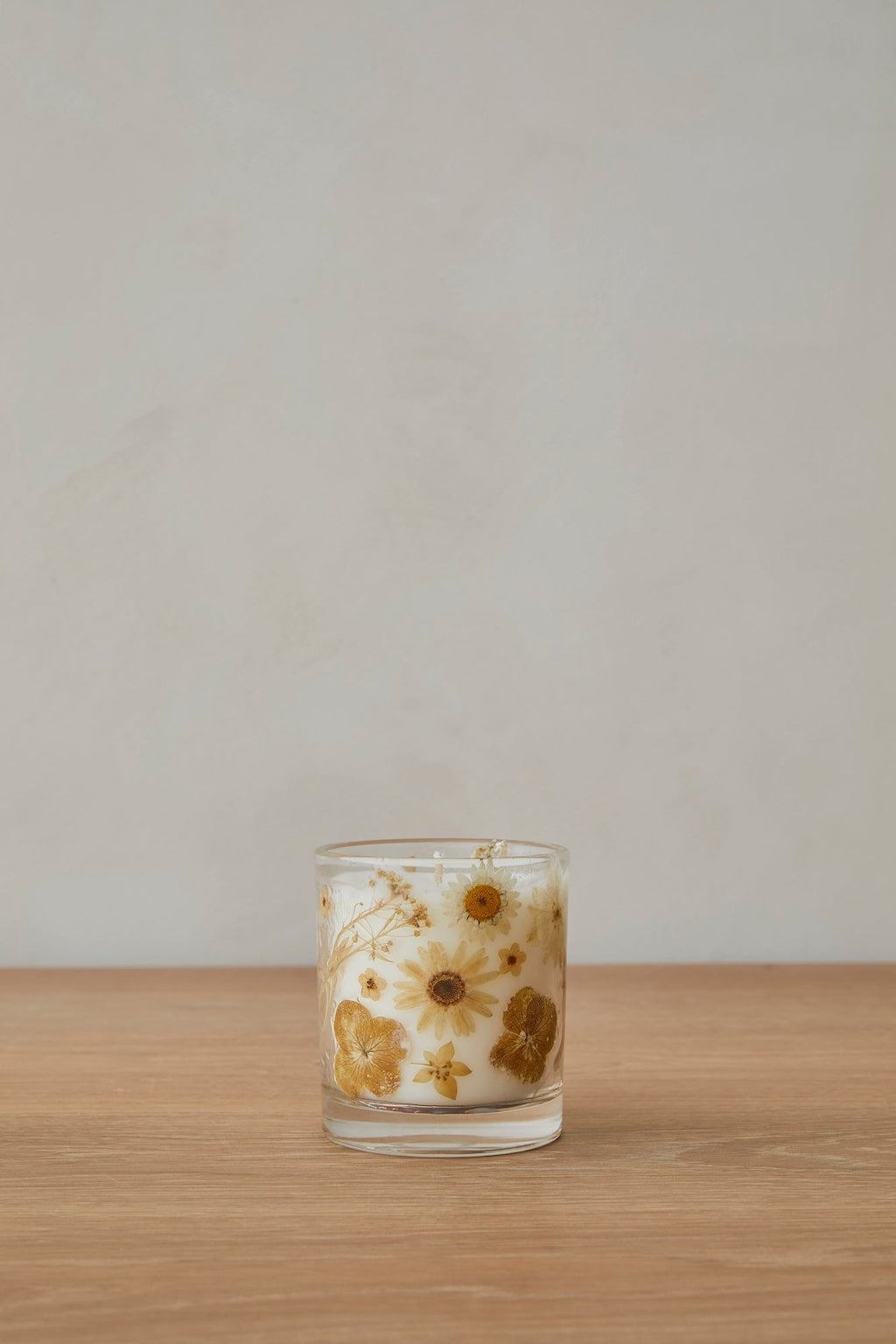 In Bloom Candle with floral design and gardenia jasmine scent by Saffron + Poe