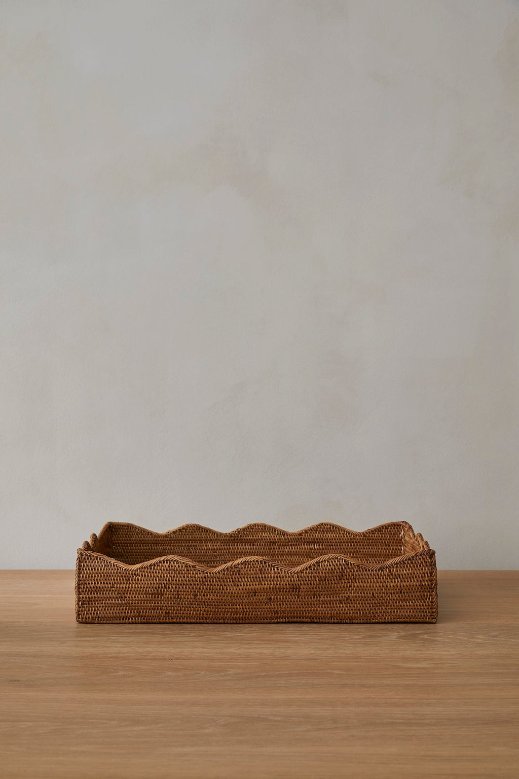 Handwoven Ionian Tenganan Tray with organic wavy edges made from natural Ata reed, ideal for home decor and organizing.