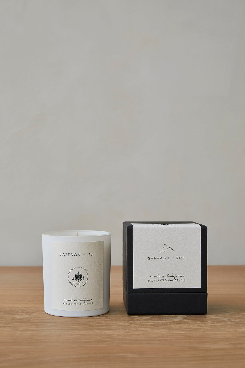 Marin Candle with elegant design and rich fragrance notes of santal, cardamom, and amber mist