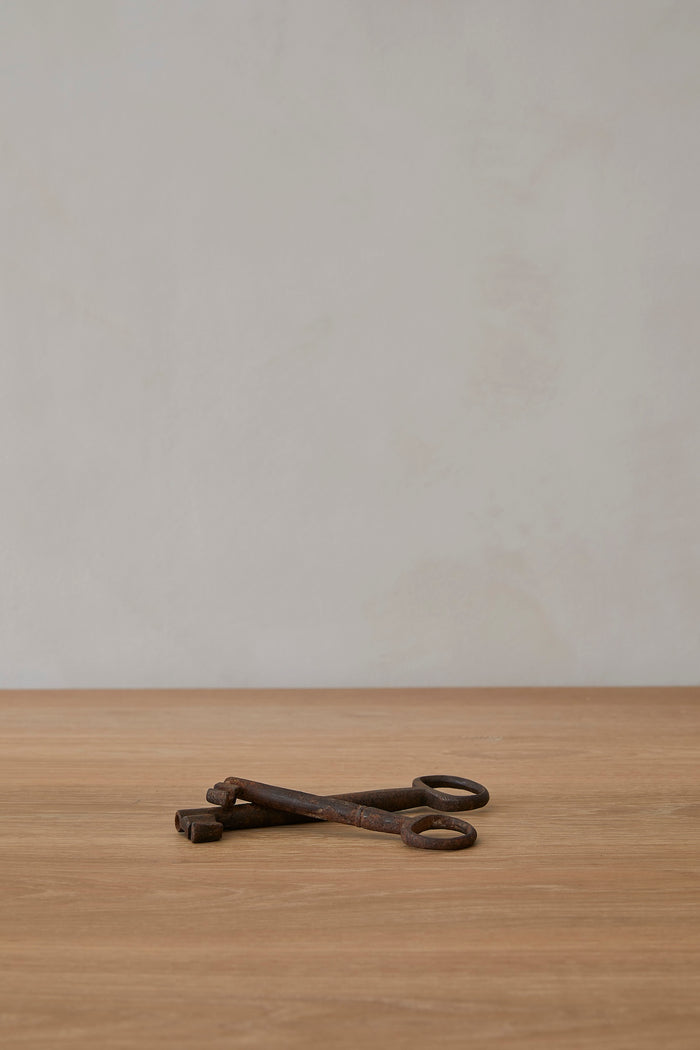 Antique Pugliese Key on a wood table with limewash background