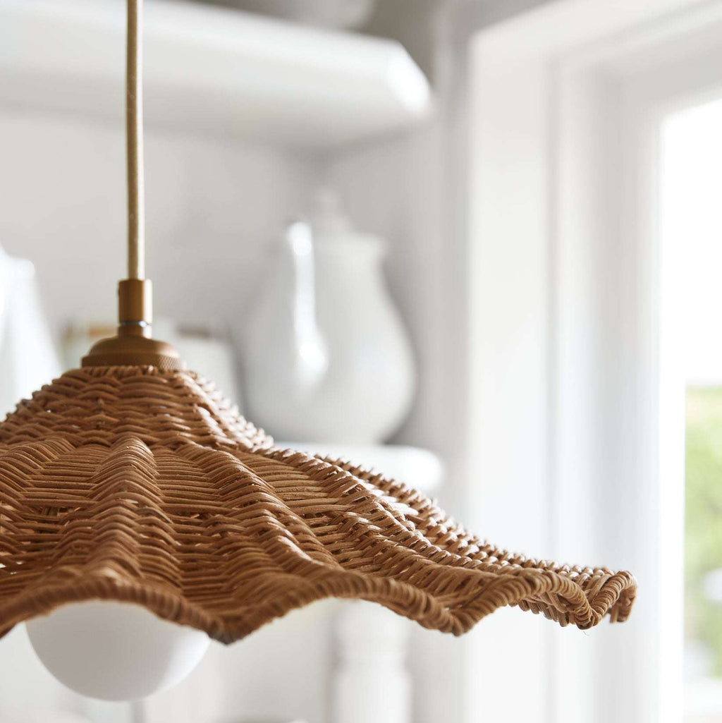 Woven Savannah Pendant light with a textured design on a blurred background