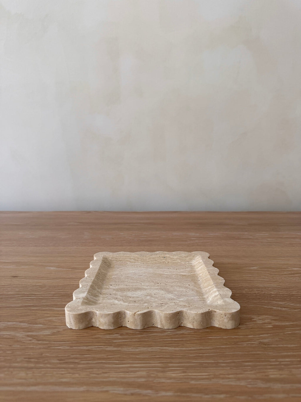 Scalloped Travertine Tray with hand-carved natural stone and soft undulating edges for elegant home decor