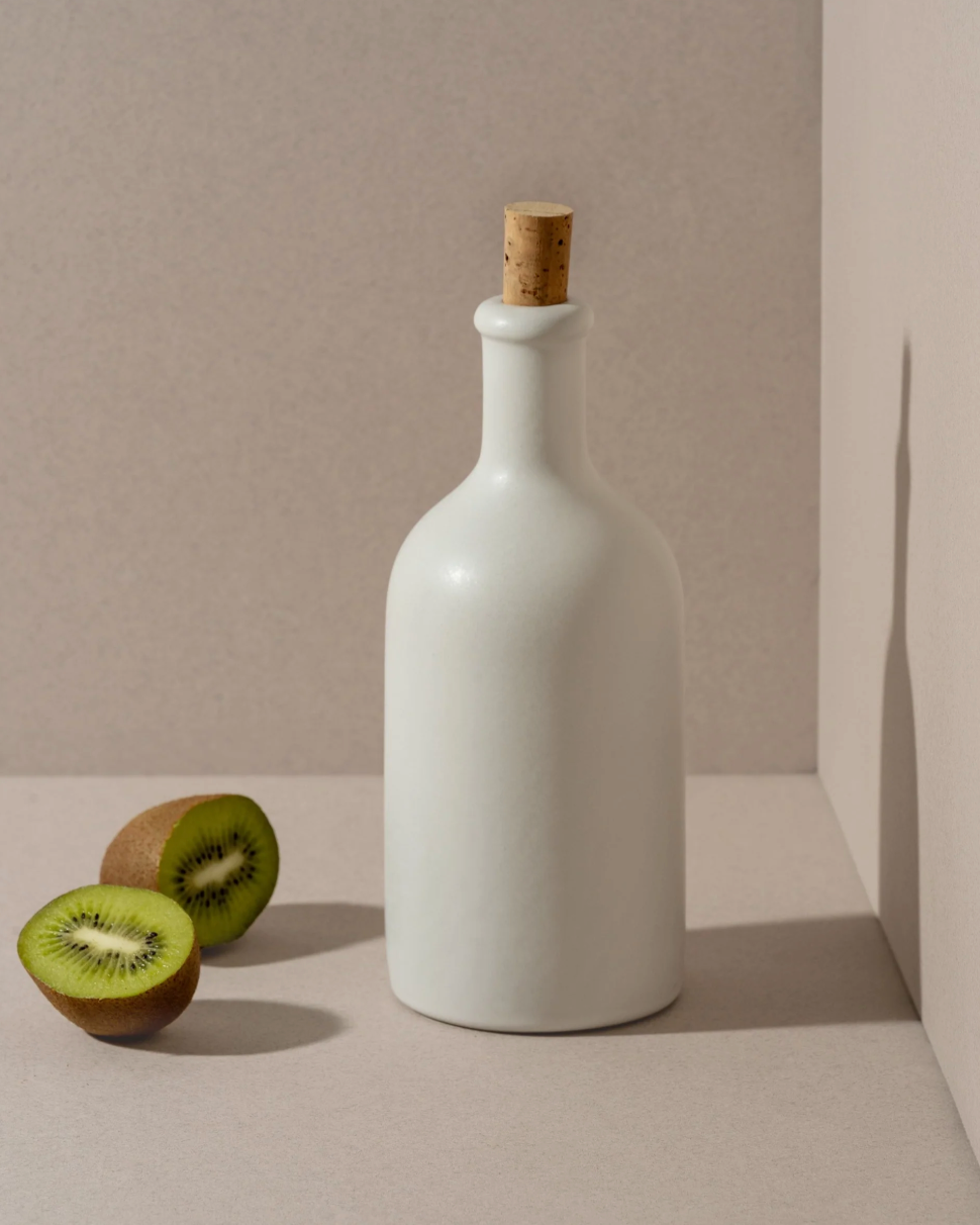 Handmade stoneware olive oil dispenser with matte finish by Tunisian artisans
