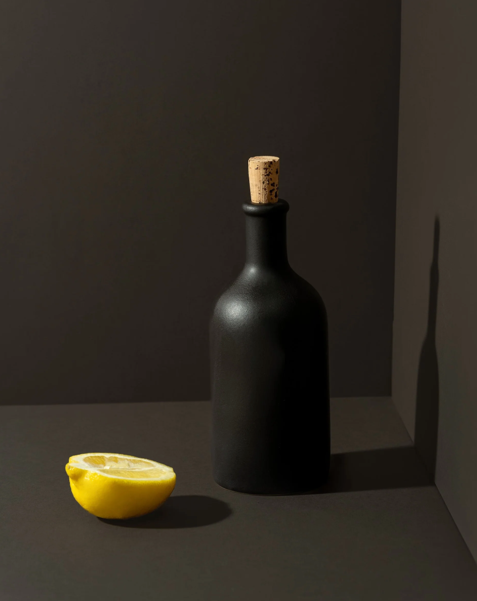 Handmade stoneware olive oil dispenser with matte finish by Tunisian artisans