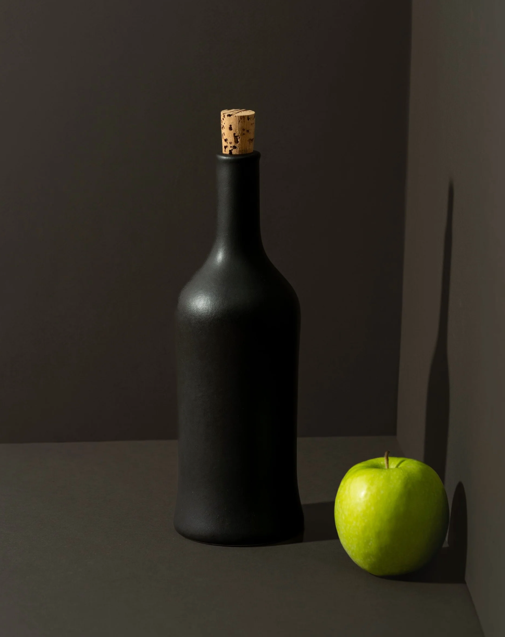 Handcrafted stoneware olive oil dispenser with soft matte glaze inspired by Tunisian coastal tradition