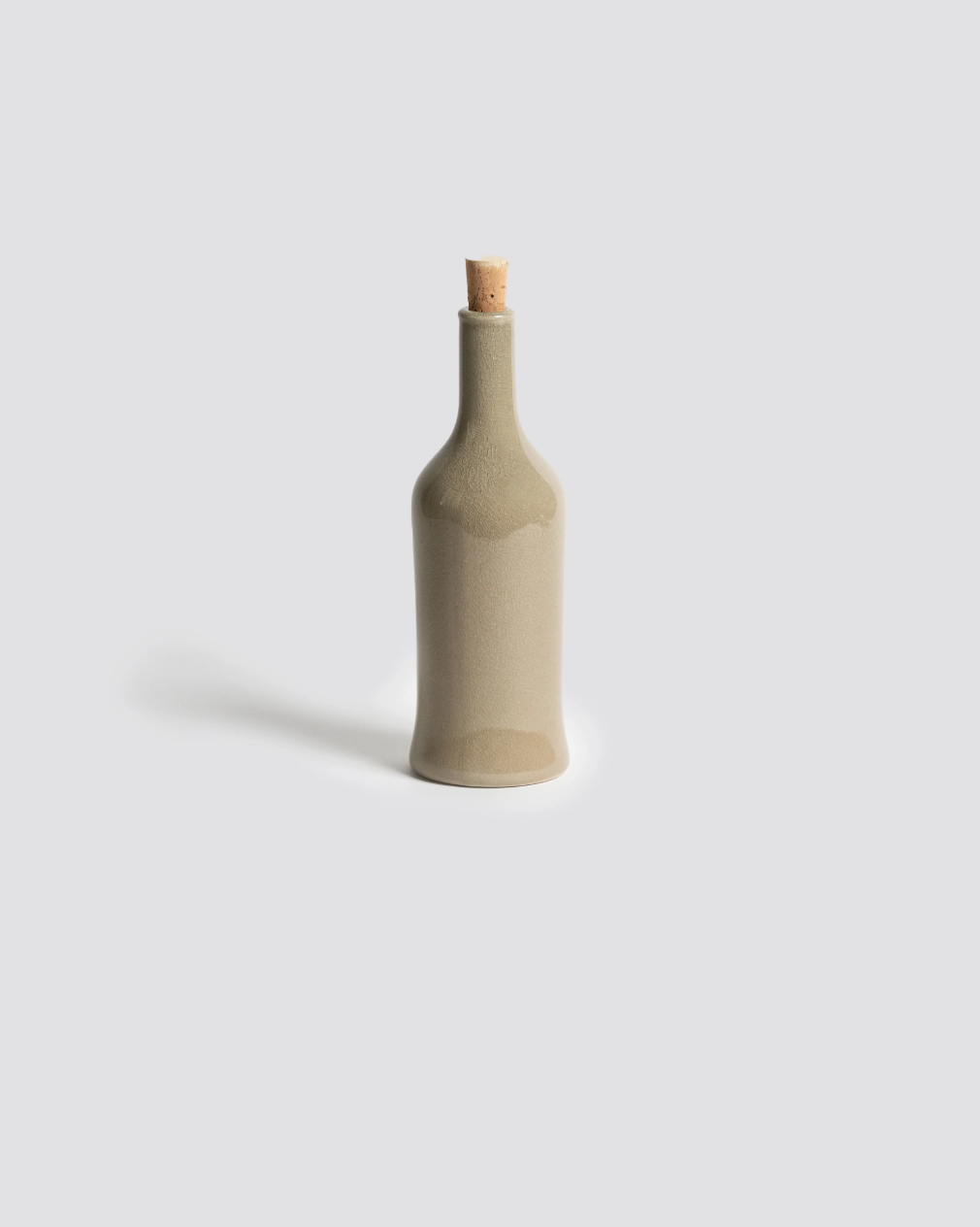 Handcrafted stoneware olive oil dispenser with matte glaze inspired by Tunisian artisanal tradition