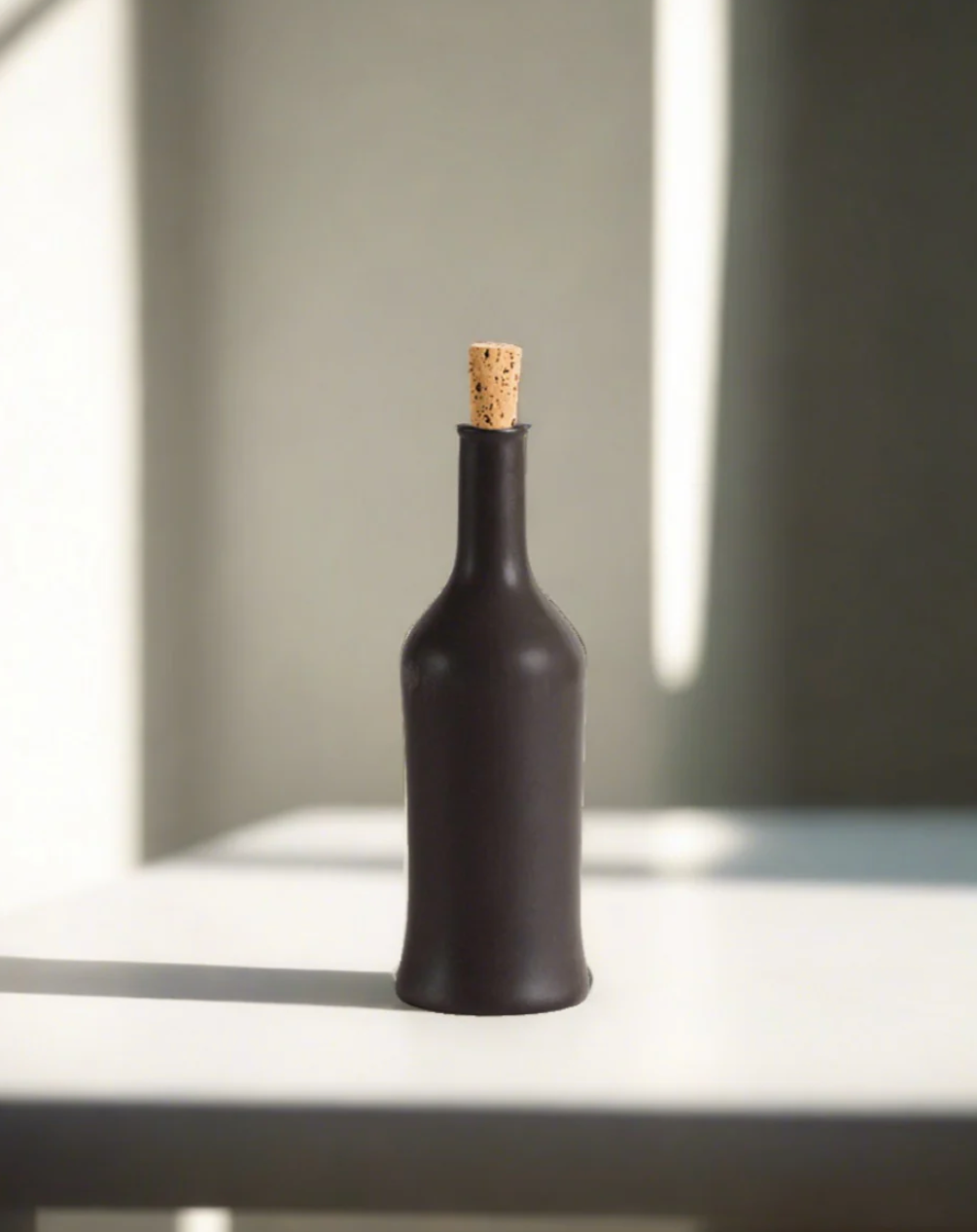 Handcrafted stoneware olive oil dispenser with matte glaze inspired by Tunisian coastal craft