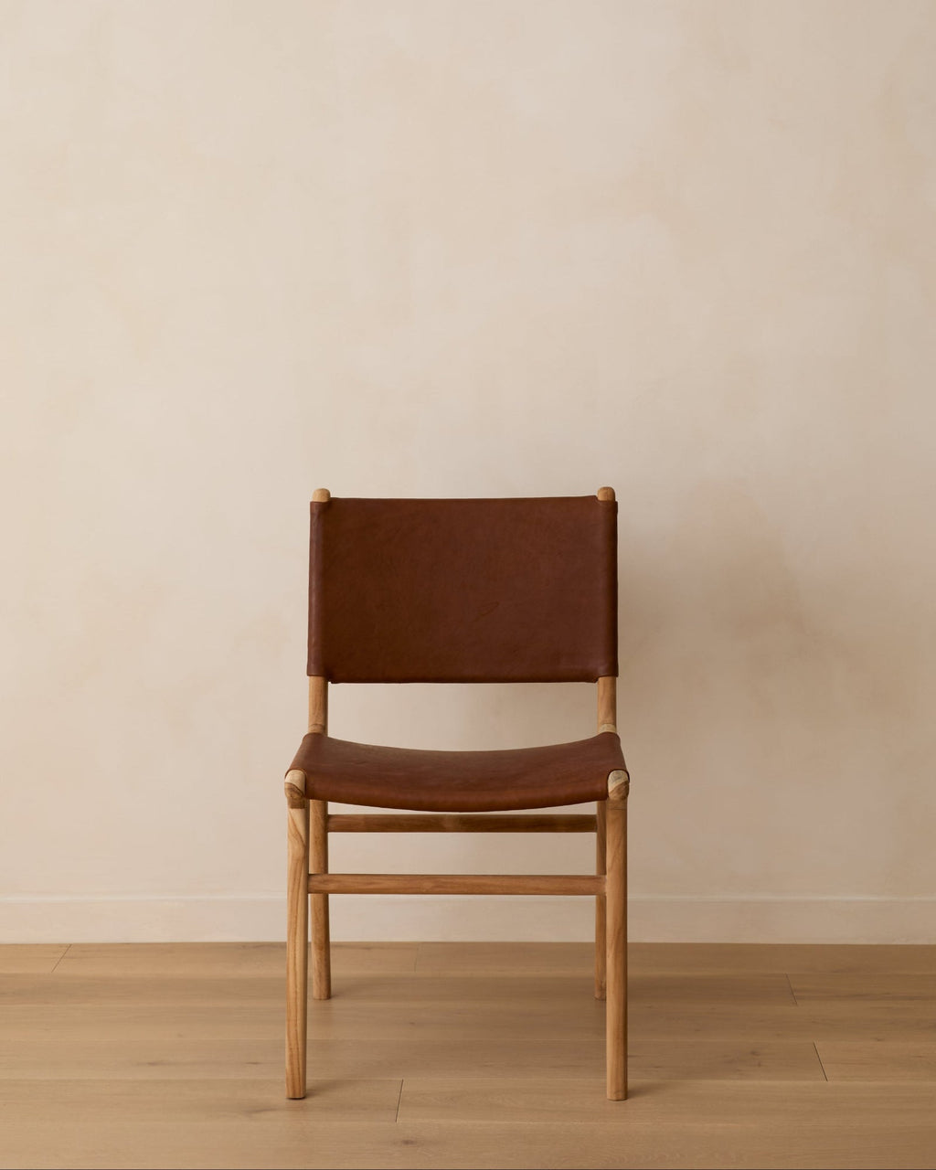 Sofia Dining Chair with smooth saddle leather and Javanese teak wood frame