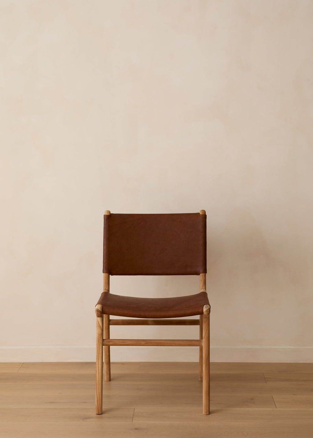 Sofia Dining Chair in saddle leather with leather ties and Javanese teak wood, second quality with natural leather variations and imperfections