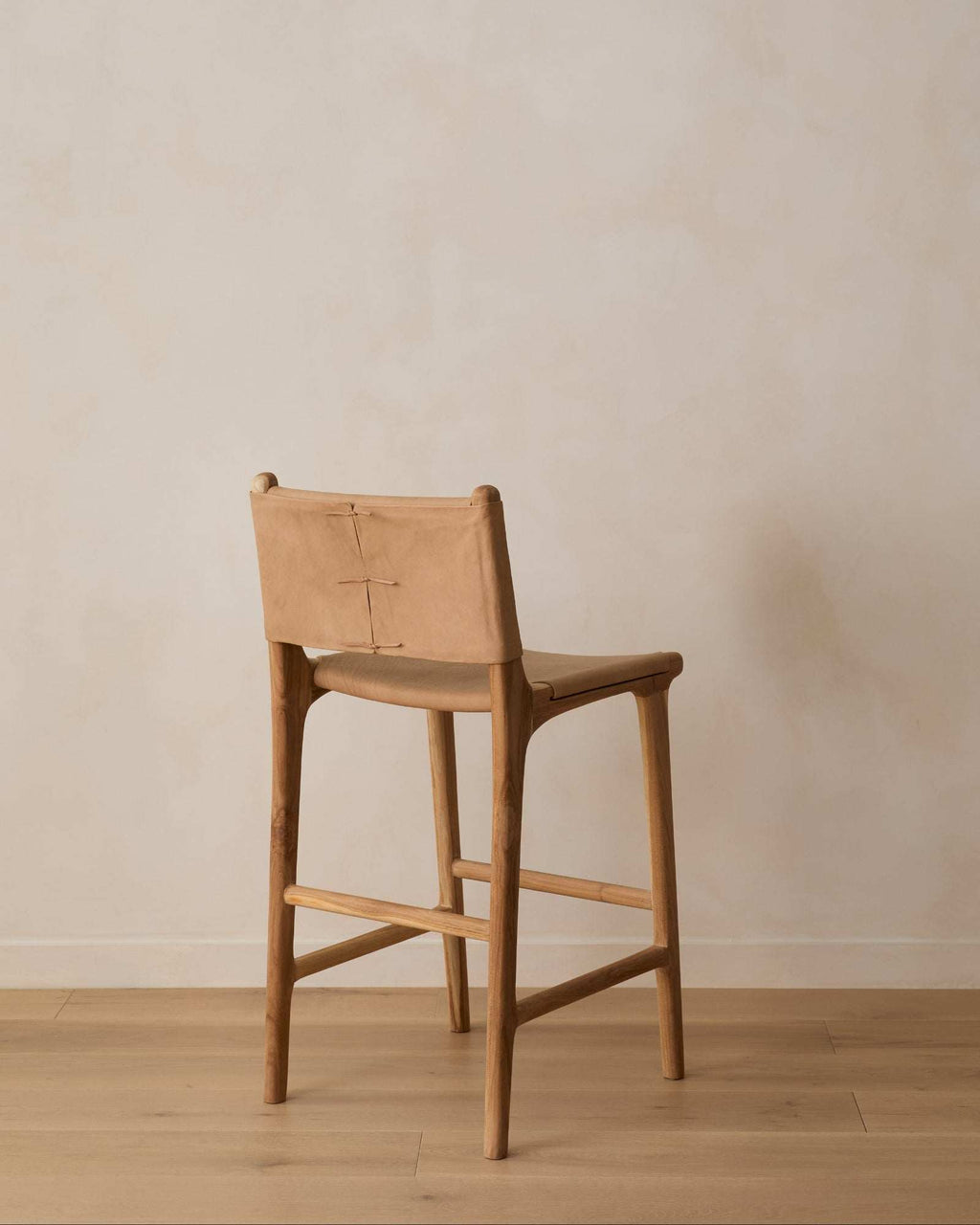 Beige Sofia Counter Stool with smooth leather and teak wood crafted in Bali