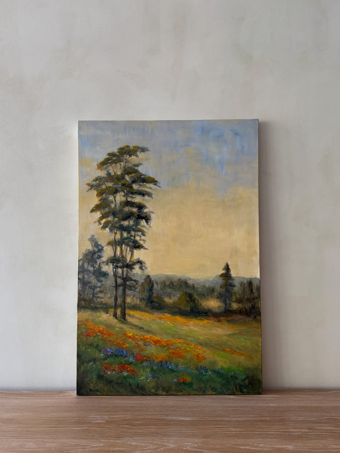 Product shot of landscape oil painting featuring rolling flower fields and trees in the distance. - Saffron + Poe 