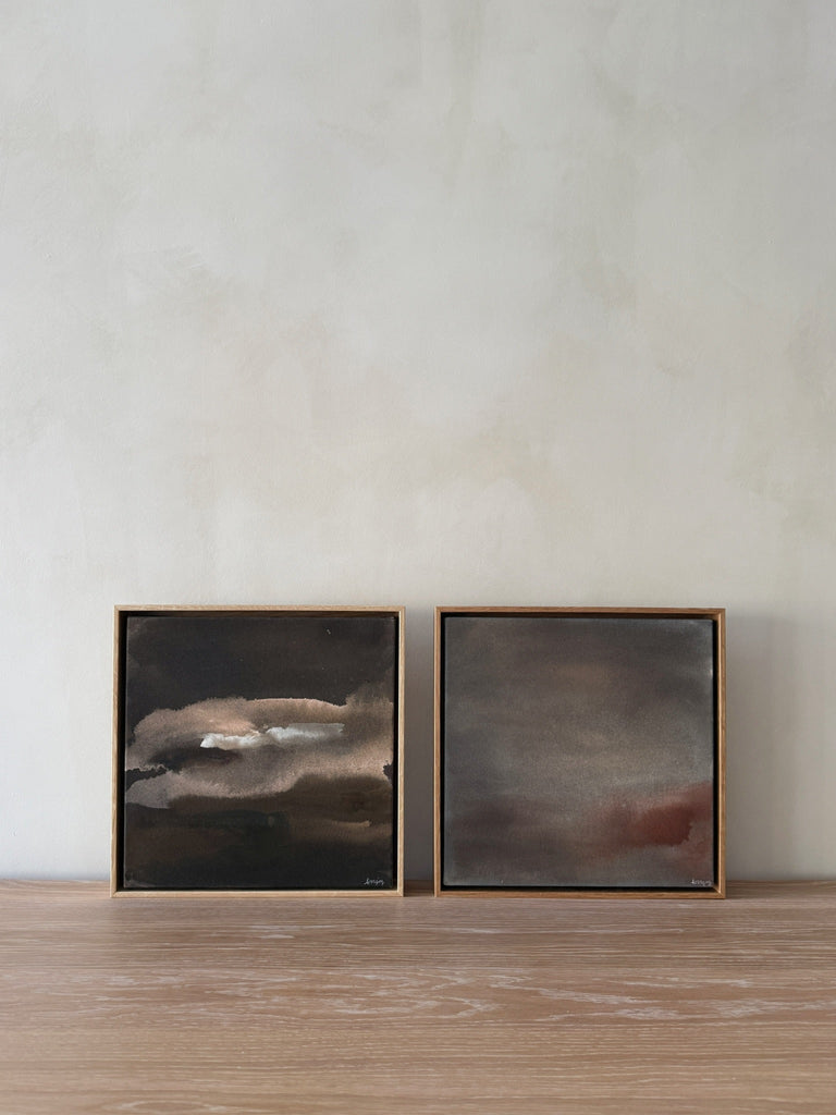 Strata and Nocturne hand-paintings by Jaime Lovejoy on oak dining table against lime washed wall. Saffron + Poe